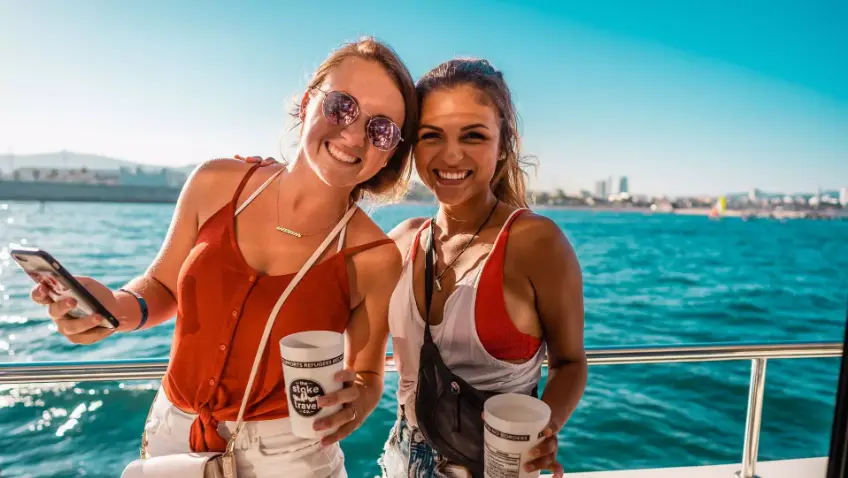 Two attractive young woman on a Barcelona Boat Party by Stoke Travel