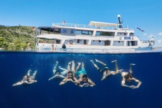 Sail Croatia Navigator passengers swimming under ship