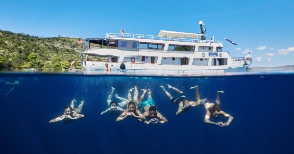 Sail Croatia Navigator passengers swimming under ship
