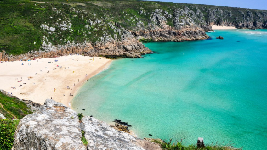 The crystal-clear waters of Porthcurno Beach in Cornwall