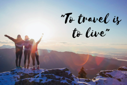 Three young women on a cliff edge at sunrise with the travel quote written saying "to travel is to live"