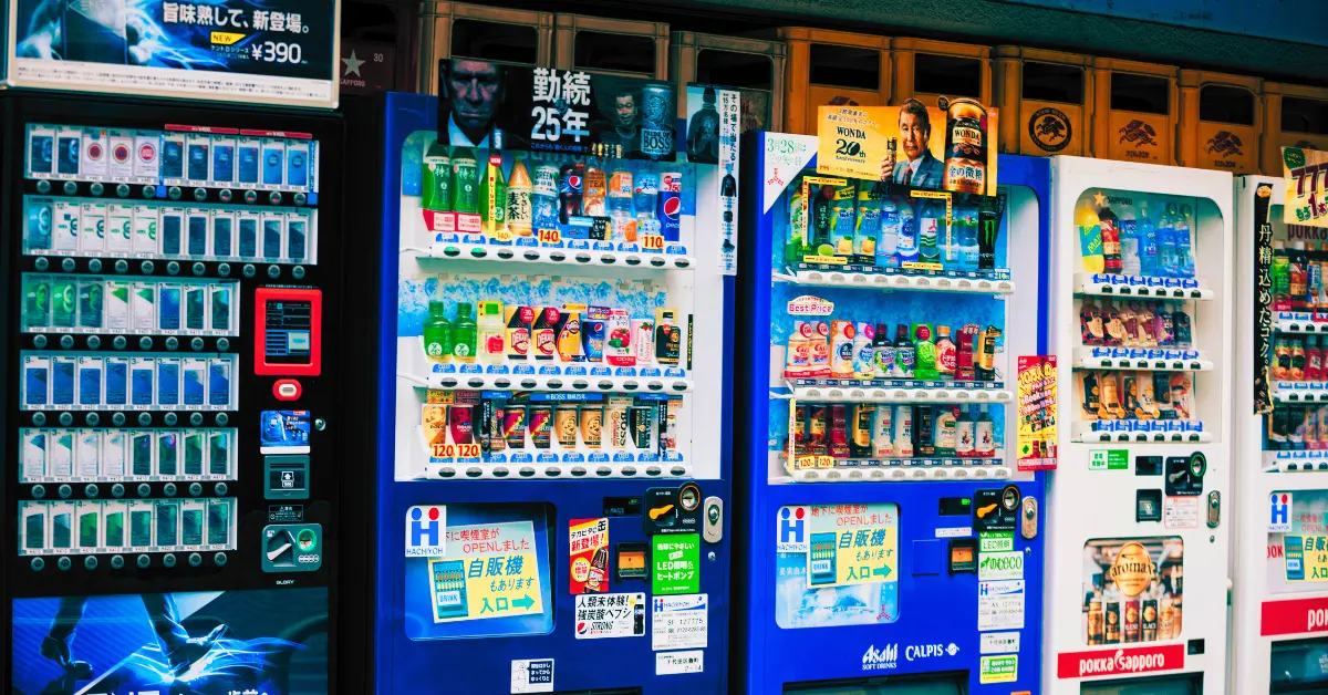 A vibrant array of Japanese vending machines displaying a colorful selection of drinks, encapsulating an interesting aspect of Japan's unique culture.