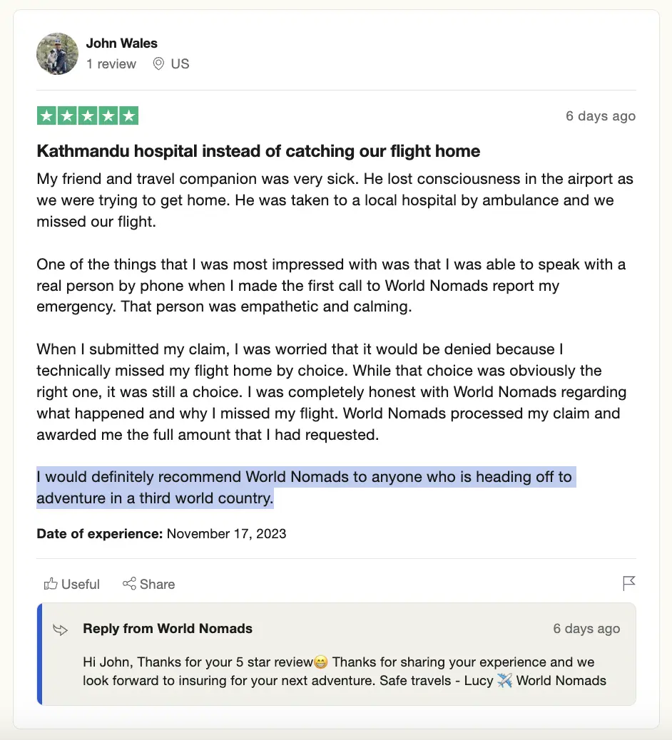 Screenshot of a 5-star review by John Wales on a review platform, praising World Nomads for their service and support during a travel emergency.