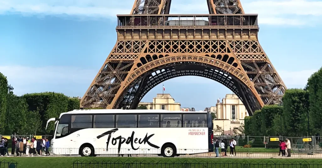 Topdeck Travel bus with eager travellers boarding for an adventure.